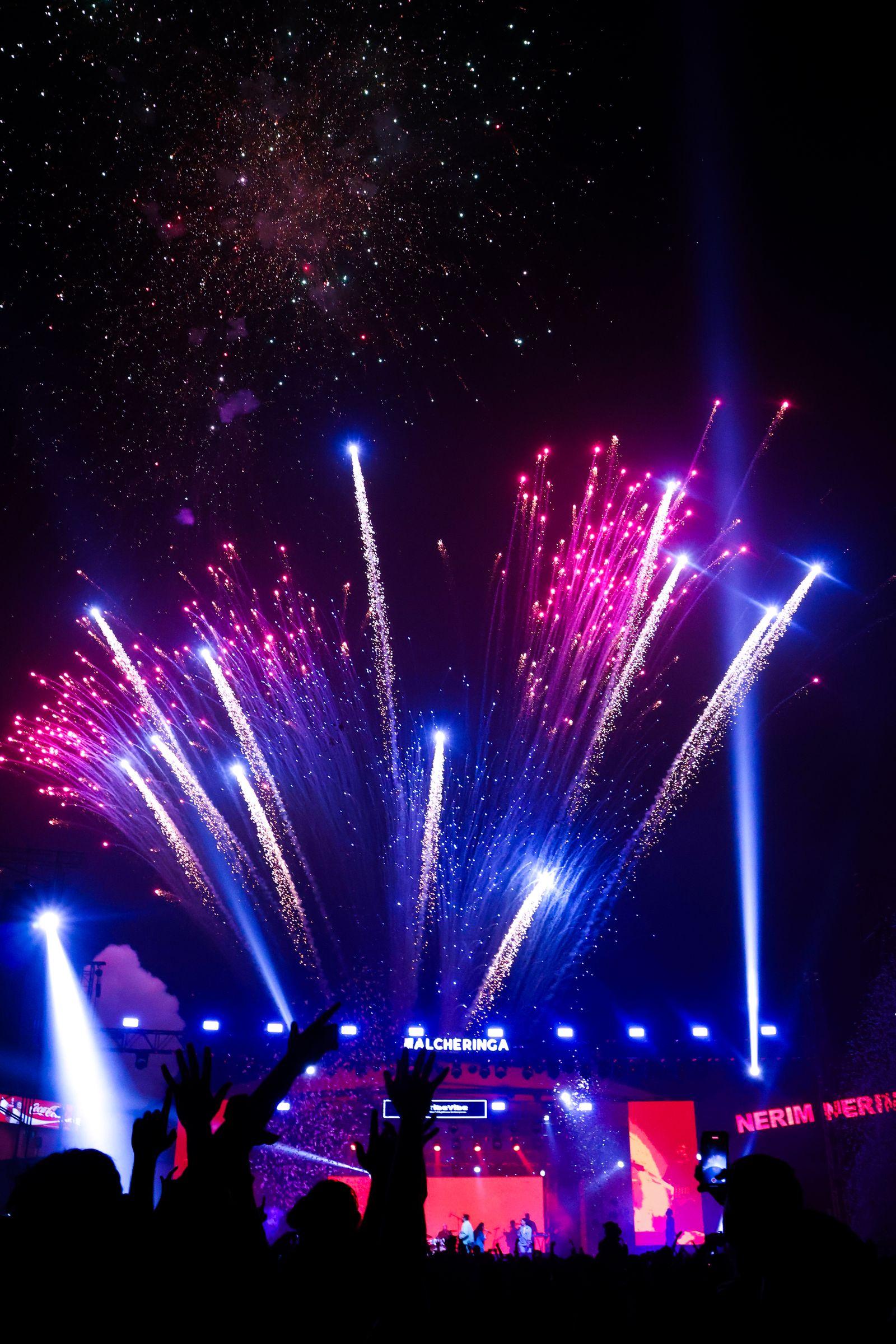 Stage pyrotechnics firing during a live concert