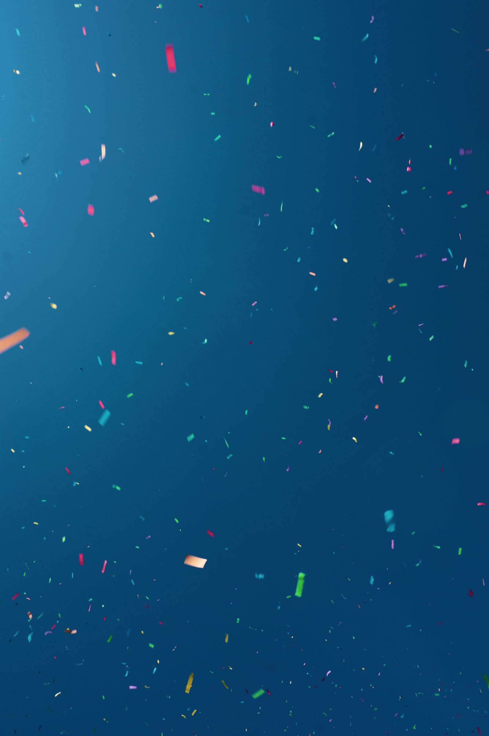 Confetti filling the air over a celebrating crowd
