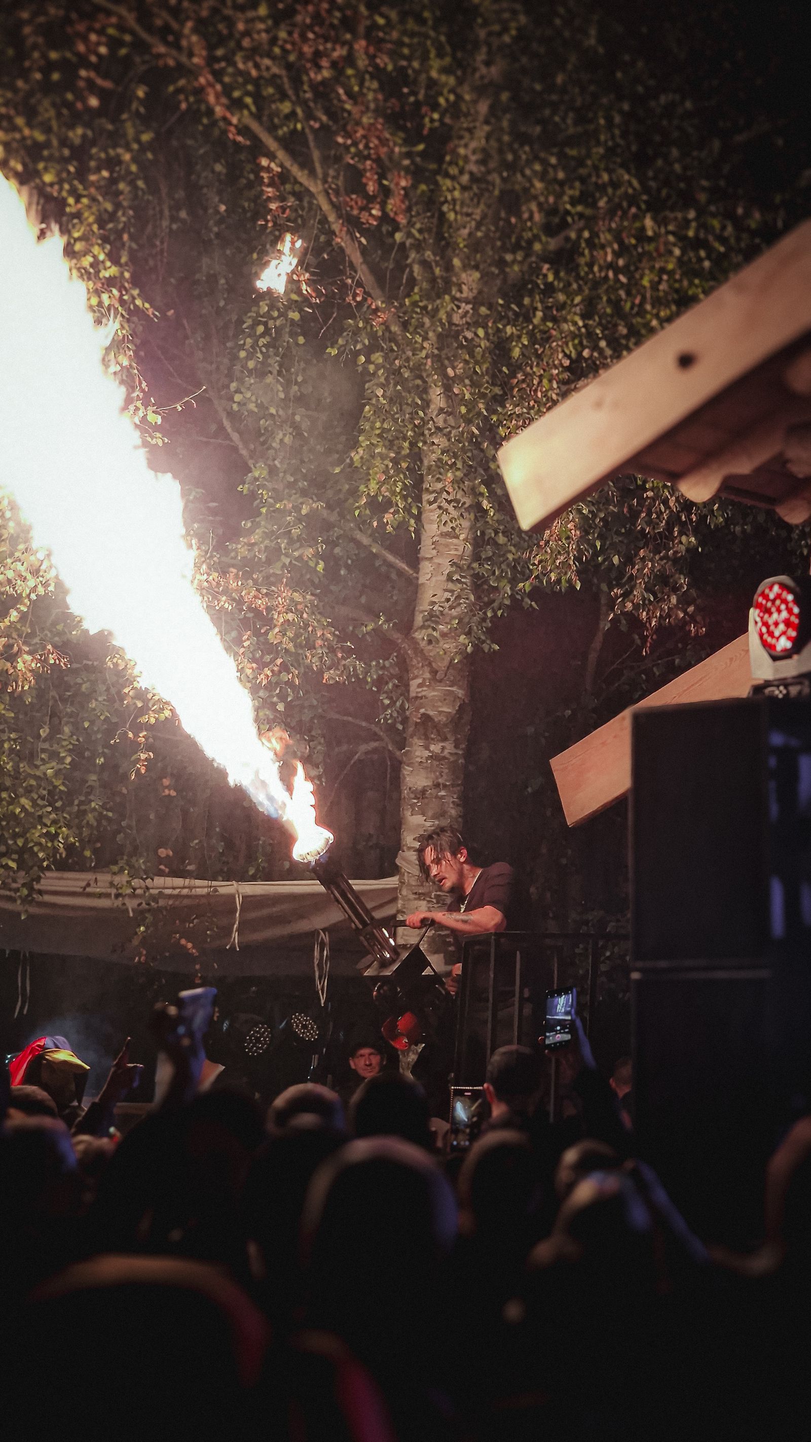 Flame columns rising behind a stage performance